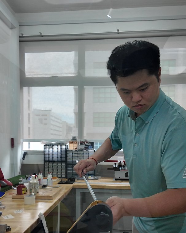 Ian, founder and master fitter at Precision Golf SG, working on a build at the studio workbench